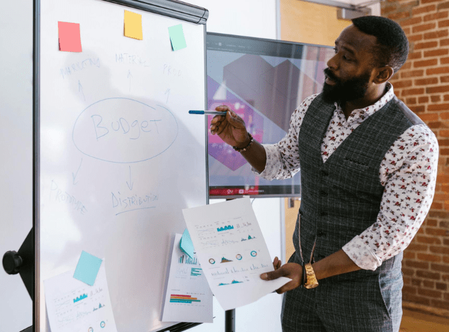 Bearded Man Presenting Budget