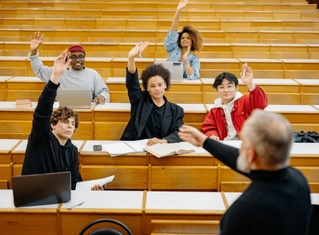 Students Raising Their Hands in a Classroom (1)