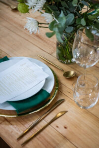 dining table with plates, cutlery and wine glasses at the Accelerate Action: A Creative Brunch for Women in Business Leadership function
