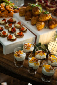 table covered with muesli and yogurt cups, croissants and other breakfast items at the Accelerate Action: A Creative Brunch for Women in Business Leadership function - 2