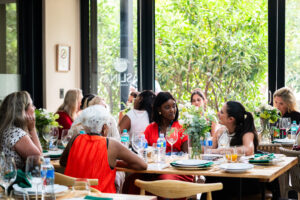 women conversing at the Accelerate Action: A Creative Brunch for Women in Business Leadership function