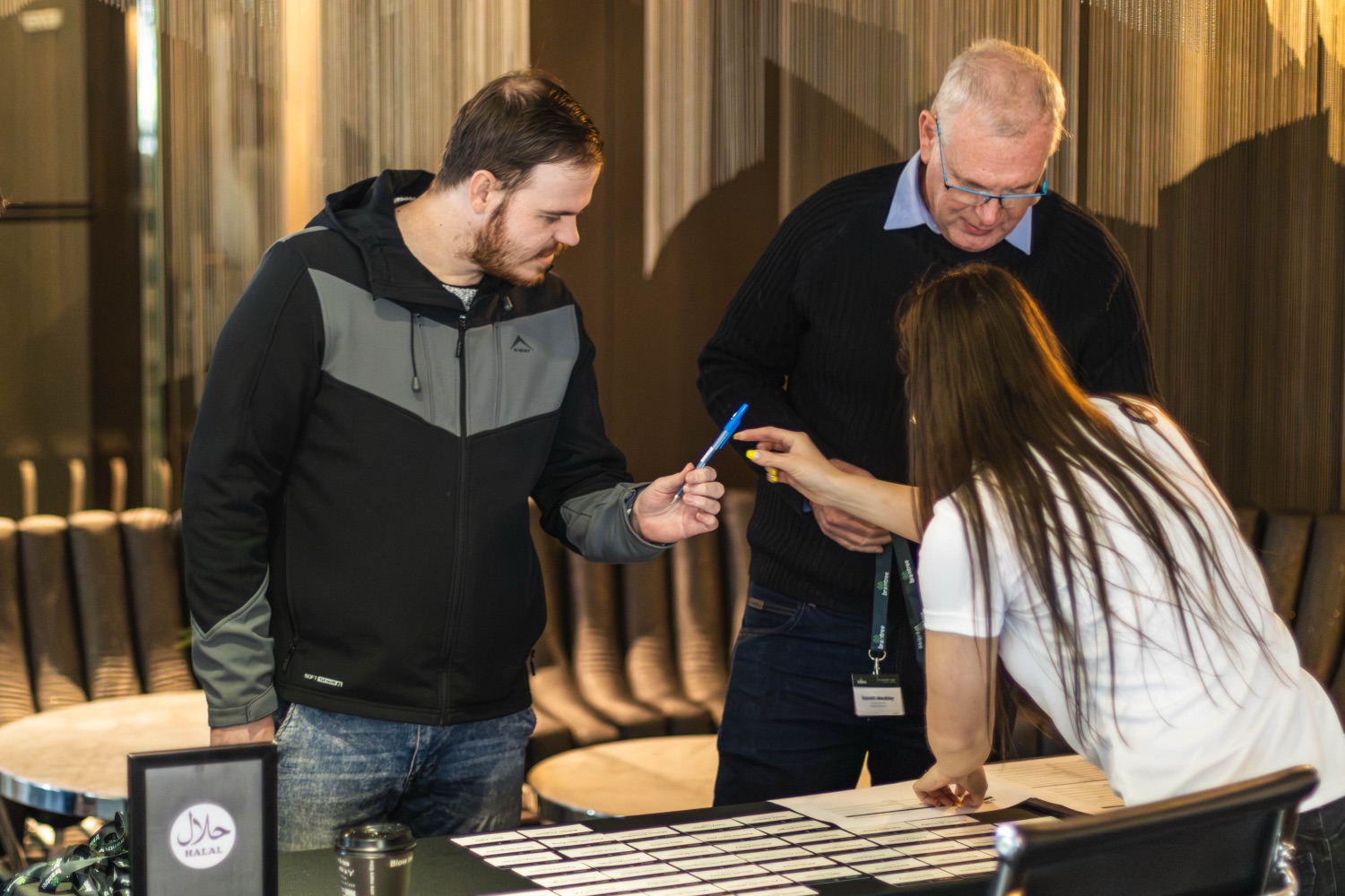 A guest checking in at the welcome desk on arrival