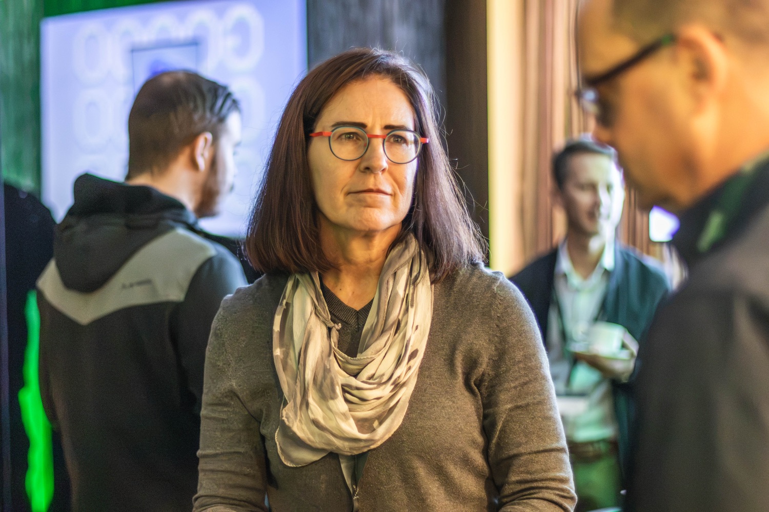 A guest at the evening reception, mid-conversation