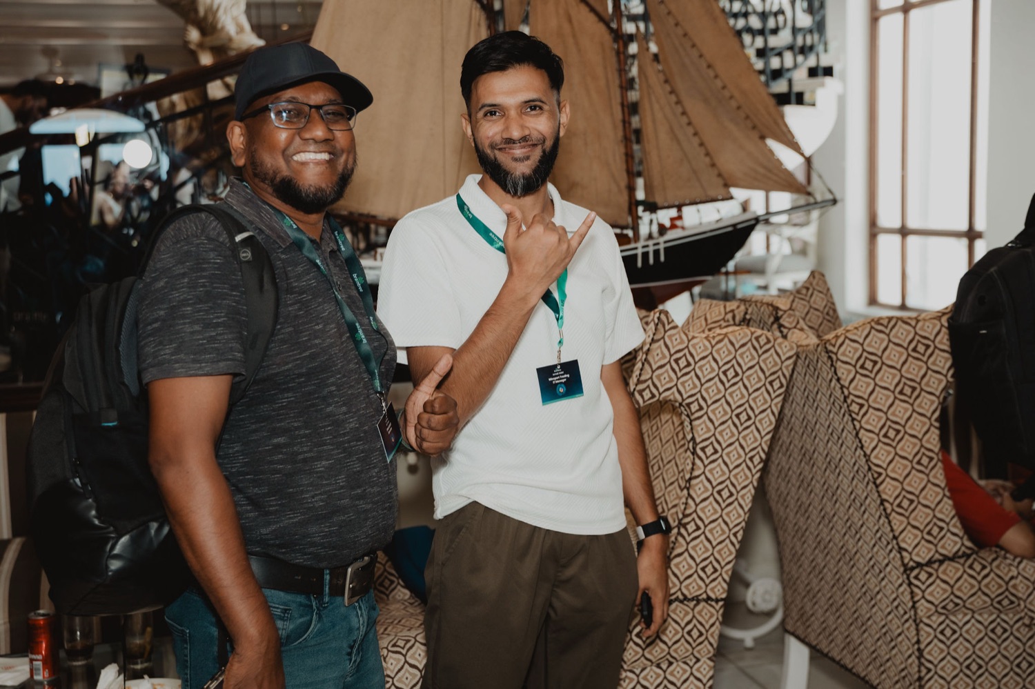 Two guests smiling for the camera during the session