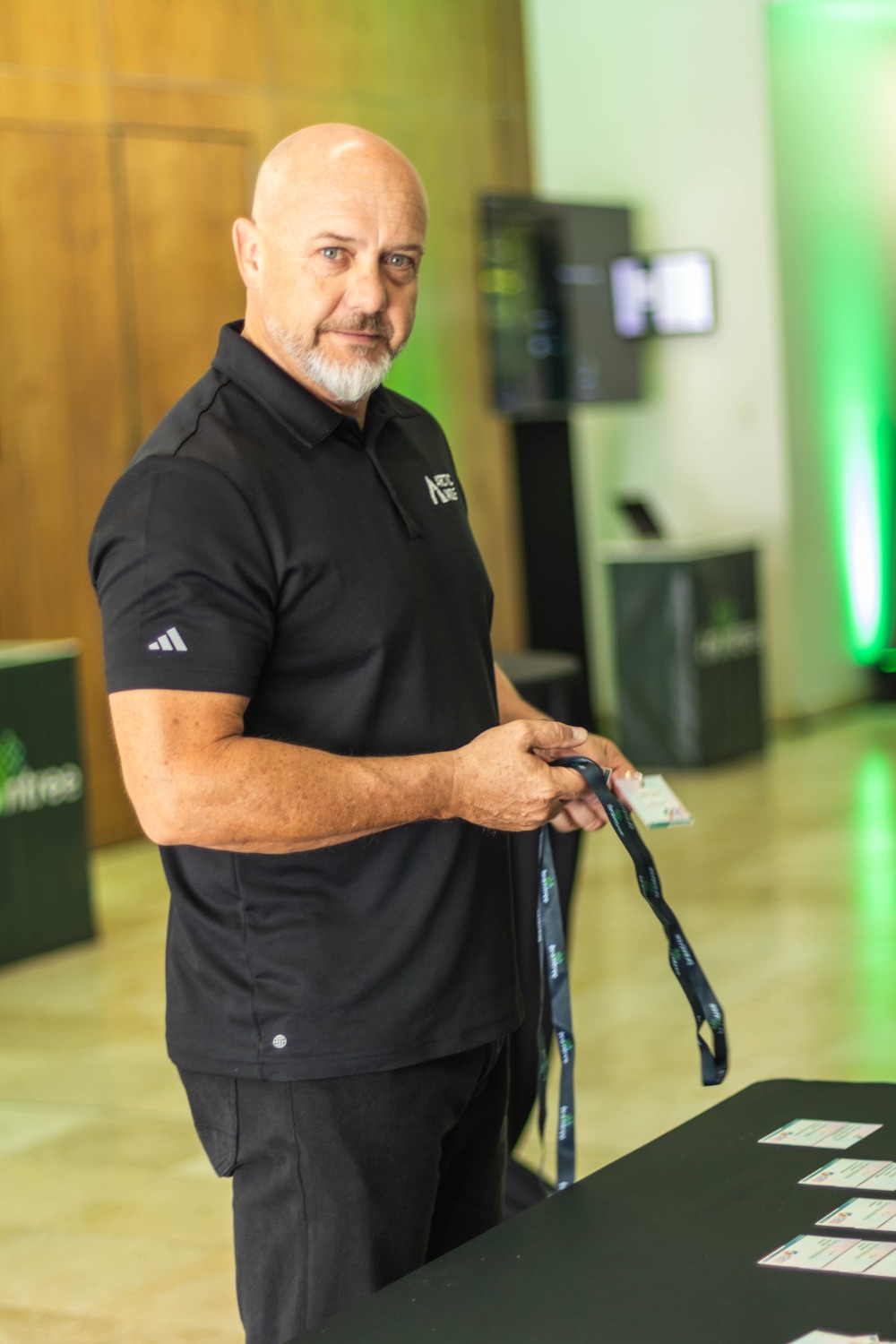 A smiling host welcoming guests at the event