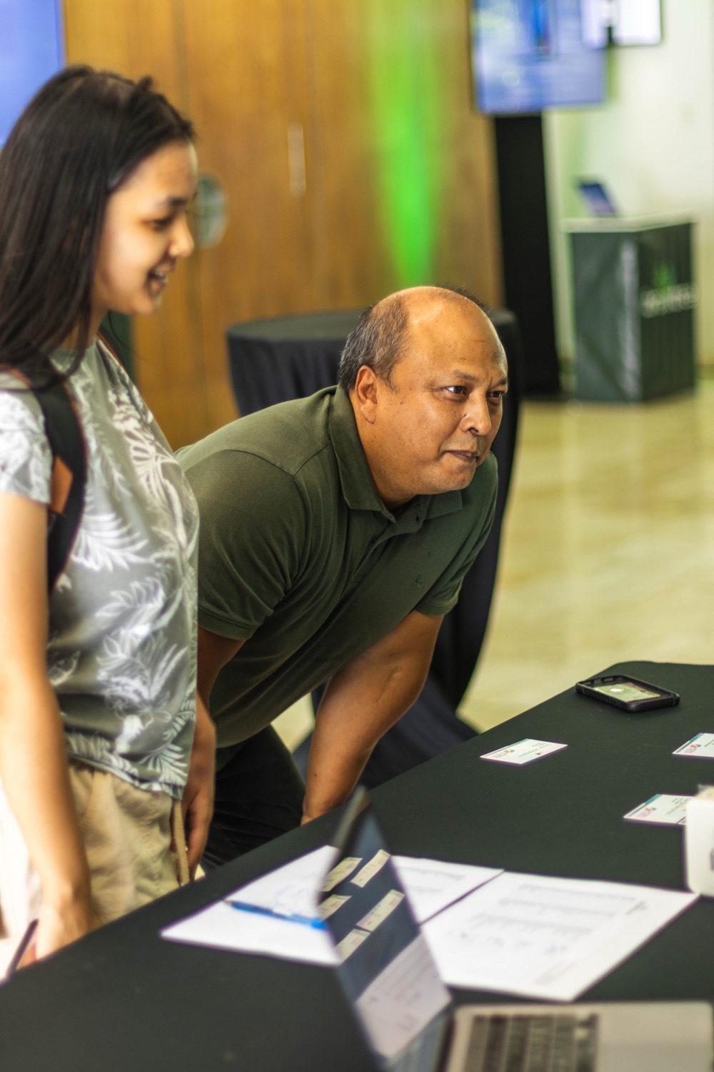 Guests checking in at the registration desk