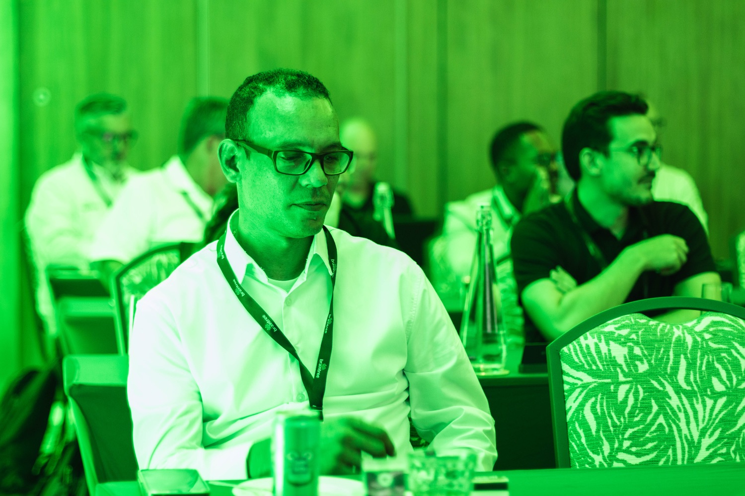 An attendee listening during a session