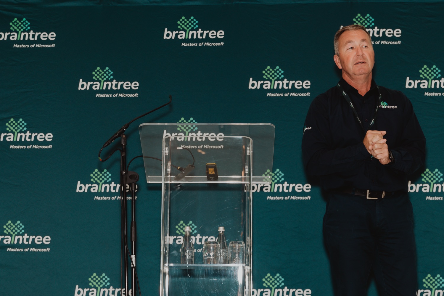 A speaker presenting at the Braintree branded podium