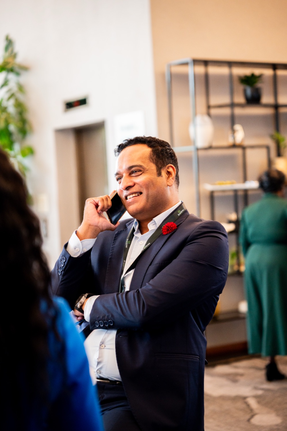 A guest taking a call in the venue lounge