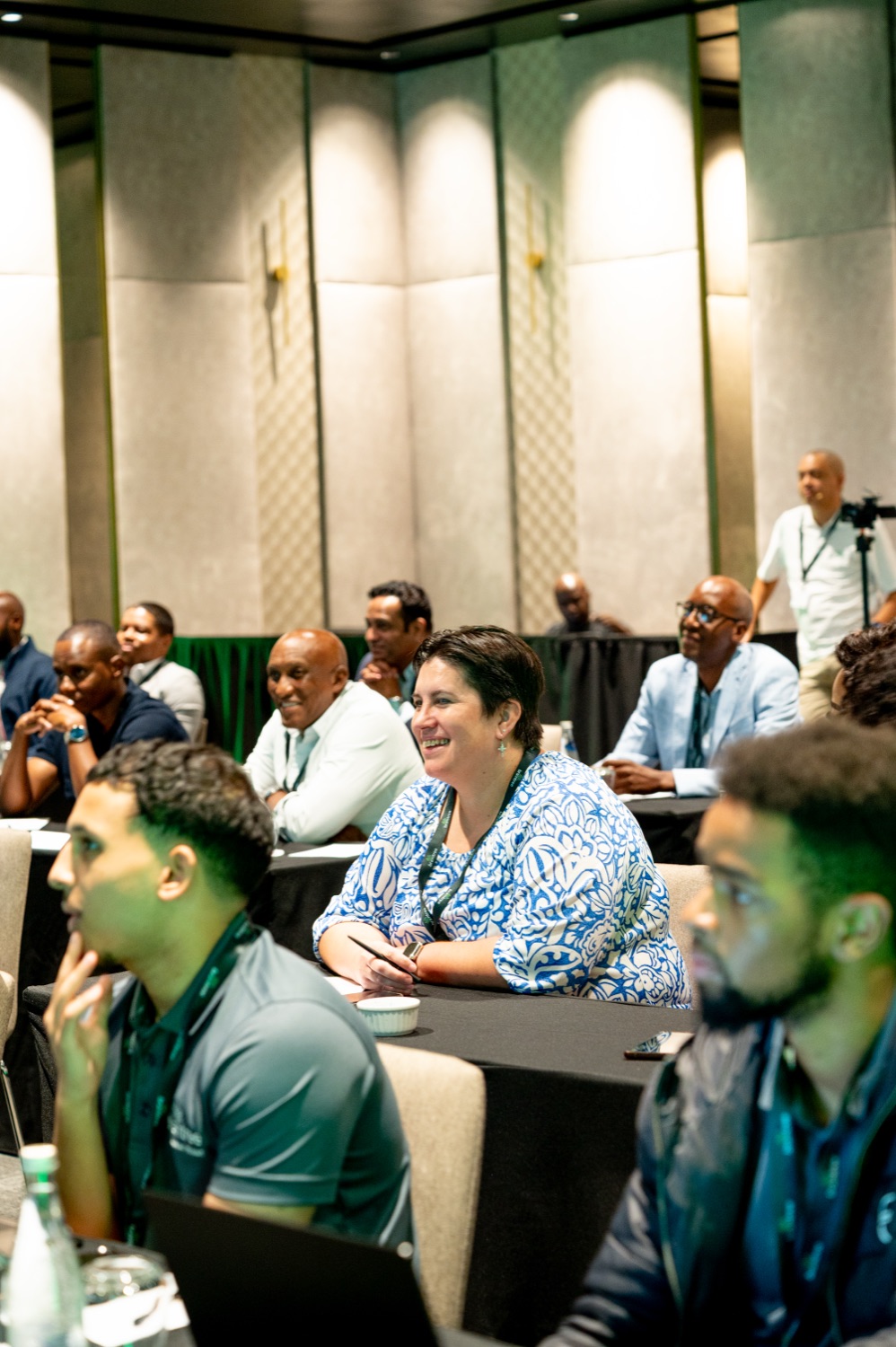 Engaged attendees listening during a session