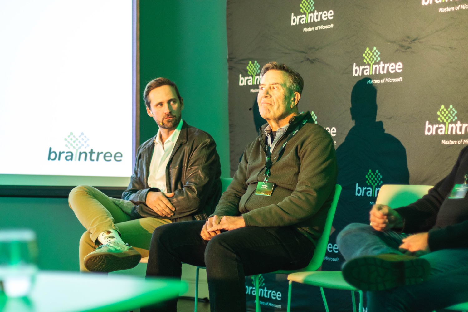 Panellists in discussion in front of the Braintree branded backdrop