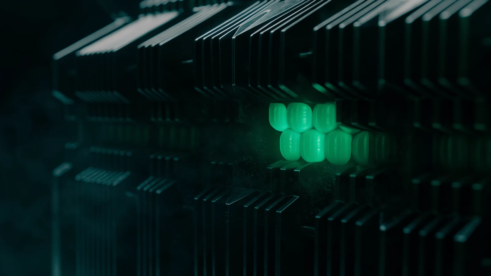 An immense dark titanium block with only a small cluster of its cores glowing jade green while the rest sit dormant, representing constrained active cores on a full-size machine.