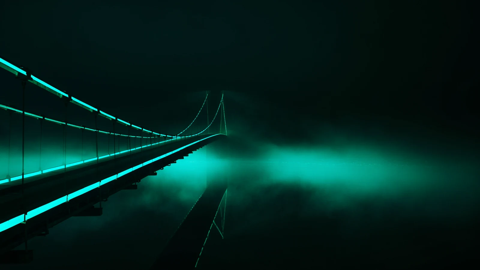 A green-lit suspension bridge over still black water at night, its span ending abruptly in mid-air above the mist.
