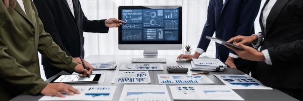An analyst team reviewing a benchmark dashboard