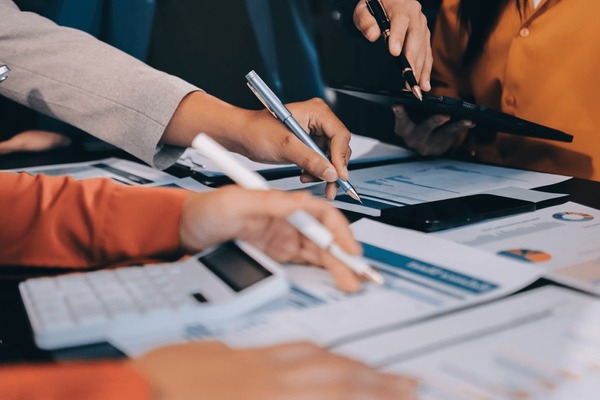 A financial services team working through the numbers