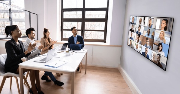 A team on a Teams call in a bright meeting room